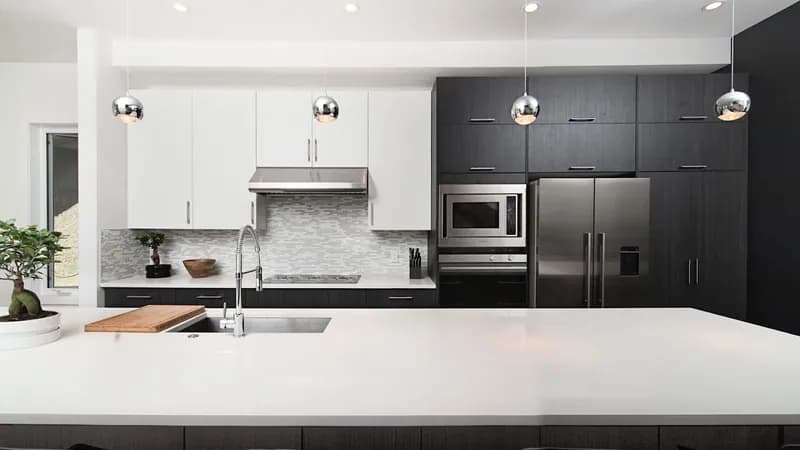 Modern kitchen remodeling in Simpsonville SC with white cabinets, quartz countertops, and stainless appliances by Burch Contracting Modern kitchen remodeling in Simpsonville SC with white cabinets, quartz countertops, and stainless appliances by Burch Contracting