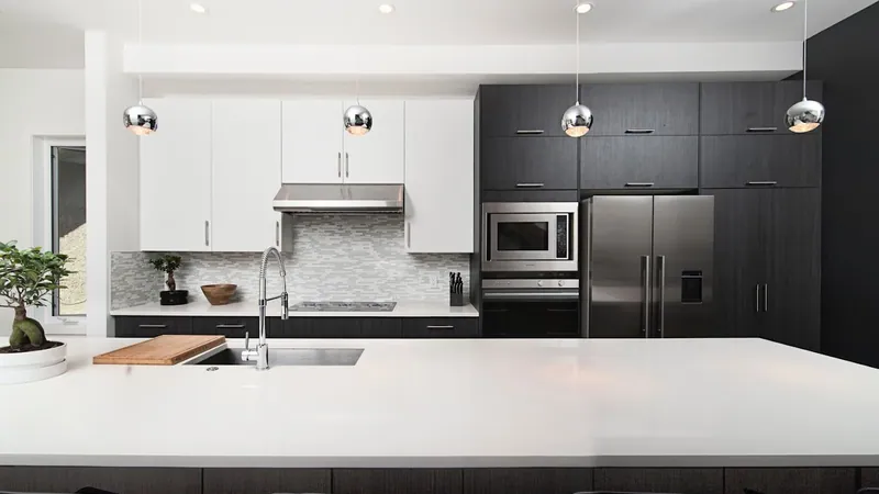 Modern kitchen remodeling in Simpsonville SC with white cabinets, quartz countertops, and stainless appliances by Burch Contracting Modern kitchen remodeling in Simpsonville SC with white cabinets, quartz countertops, and stainless appliances by Burch Contracting